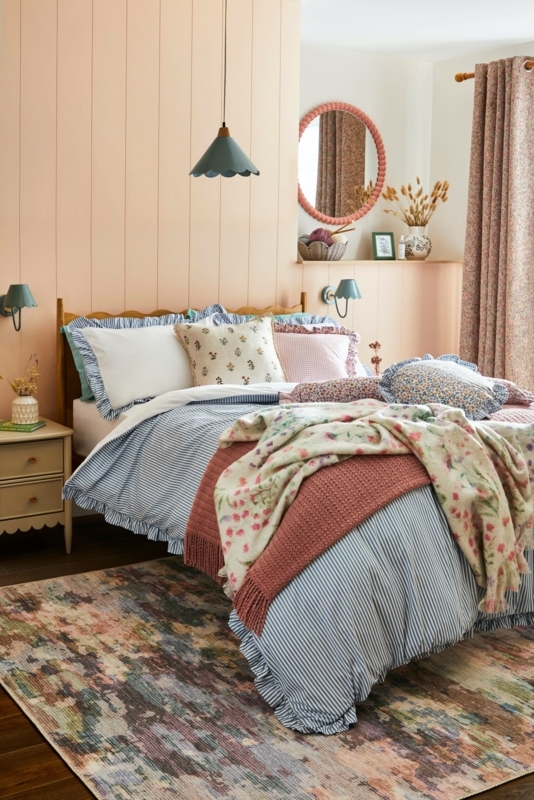 Cottagecore Bed with Ruffled Striped Bedding & Peach Paneling
