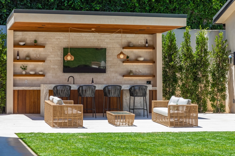 Covered Patio Lounge: Woven Pendant Lights & Stacked Stone Wall