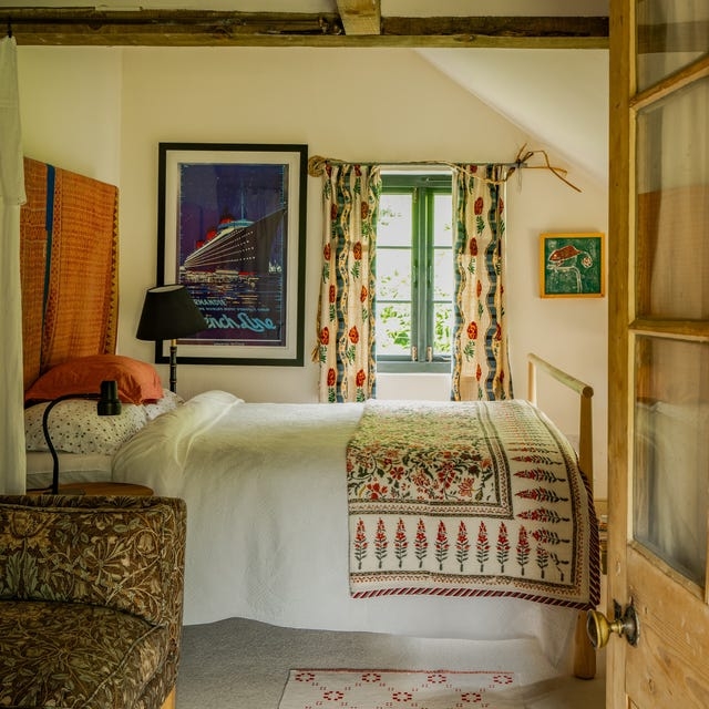 Cozy Attic Bedroom Layout with Vintage Travel Poster Wall Art.