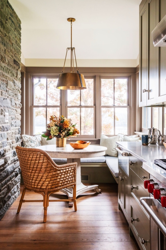 Cozy Breakfast Nook, Rattan Chair, Stone Feature Wall, Brass Pendant