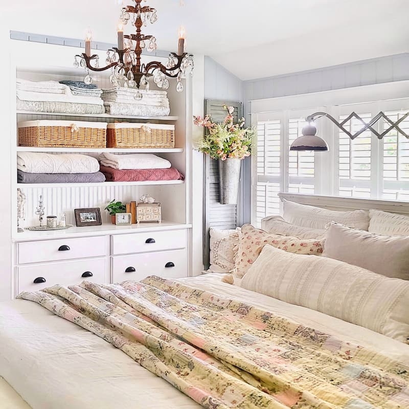 Cozy Cottage Bedroom Retreat with Patchwork Quilt and Built-In Storage