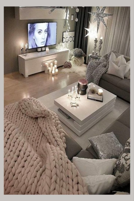 Cozy Grey Living Room with Chunky Knit Blanket and Candlelight Display