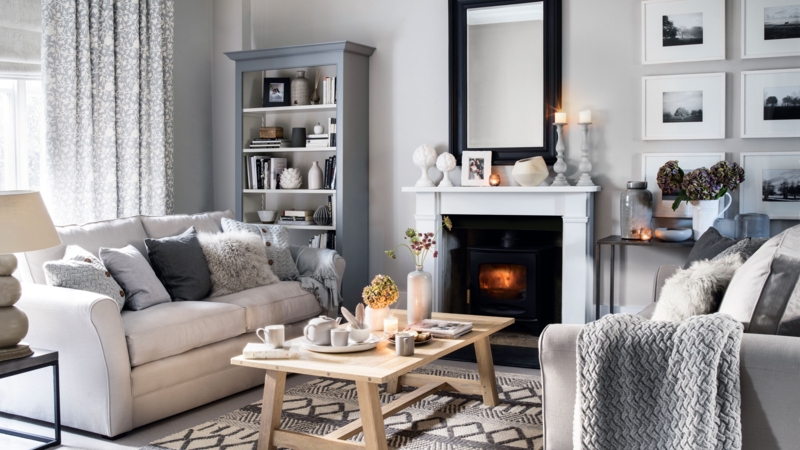 Cozy Hygge Lounge with Fireplace, Layered Knits, and Neutral Palette