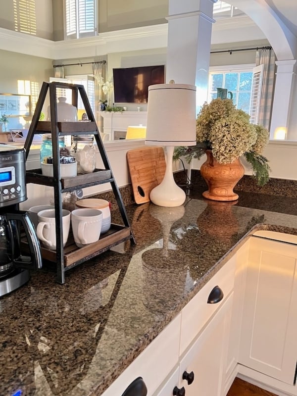 Cozy Kitchen Countertop Decor Ideas with a Tiered Stand and Table Lamp