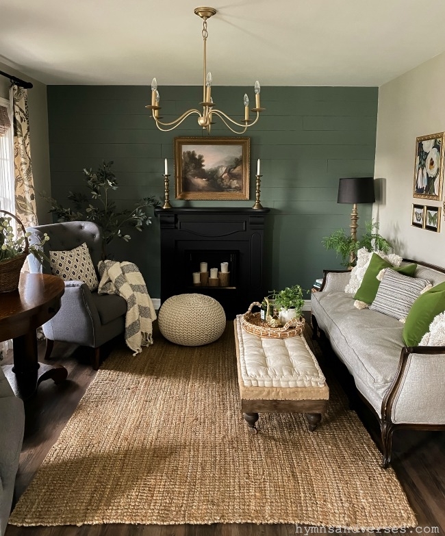 Cozy Living Room with Dark Green Shiplap and Black Fireplace