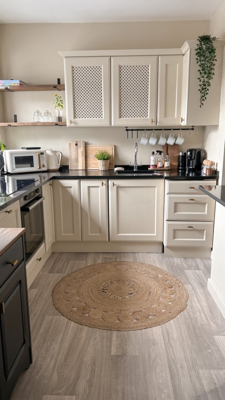 Cream Cabinets With Lattice Doors And Round Jute Rug