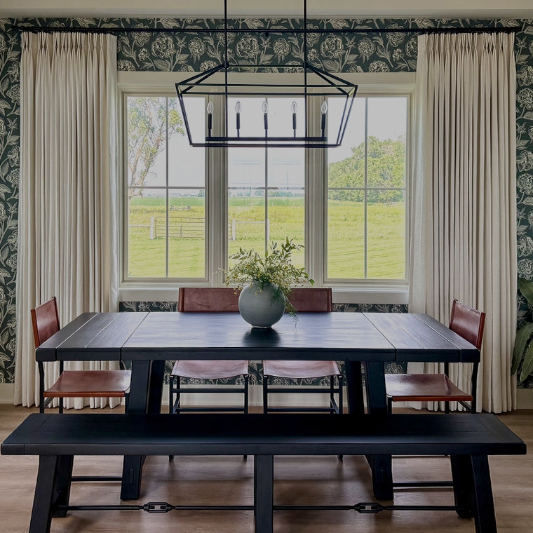 Cream Pinch Pleat Curtains against Dark Botanical Wallpaper
