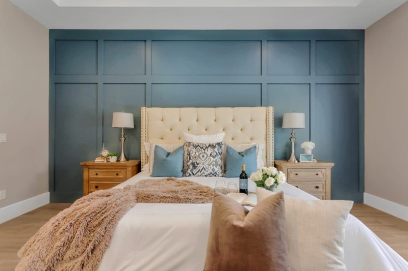 Cream Tufted Bed in Transitional Bedroom with Teal Grid Wall