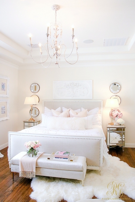 Cream Upholstered Bed with Nailhead Trim and Plush Shag Rug