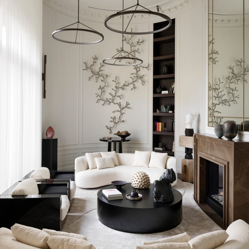 Curved Boucle Sofa Living Room with Sculptural Wall Decor and Hoop Light