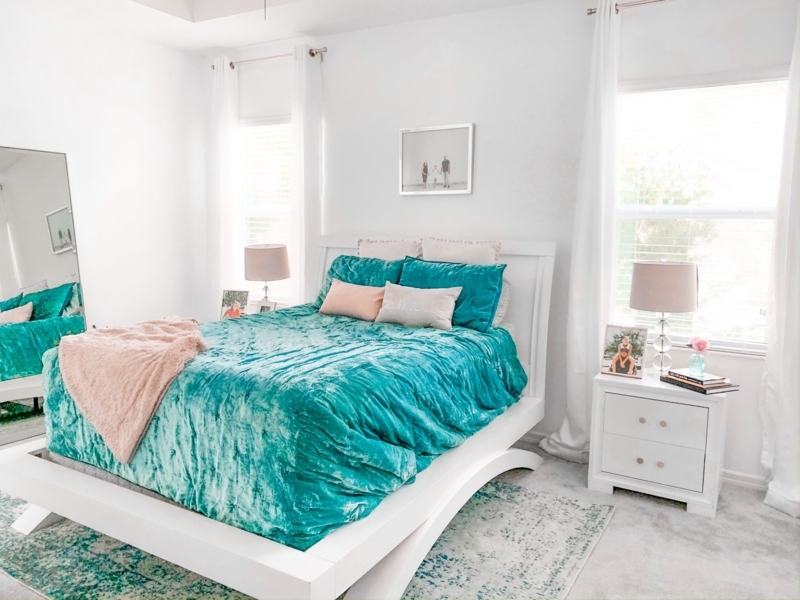 Curved White Platform Bed with Crushed Velvet Bedding