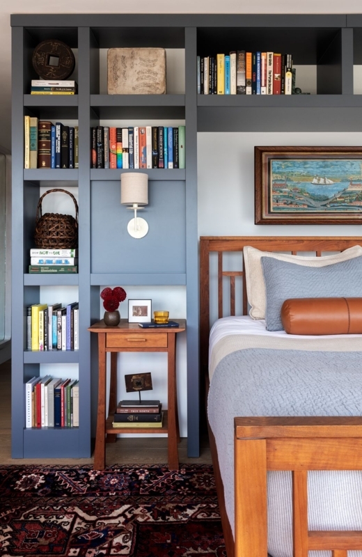 Custom Blue Built-in Shelving with Integrated Nightstand