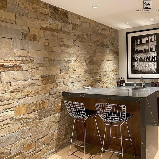 Custom Home Bar with Ledgestone Accent Wall and Waterfall Edge Counter