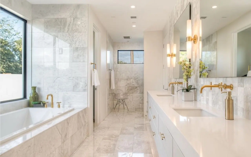 Cylindrical Sconces: Luxury Bathroom with Gold Fixtures