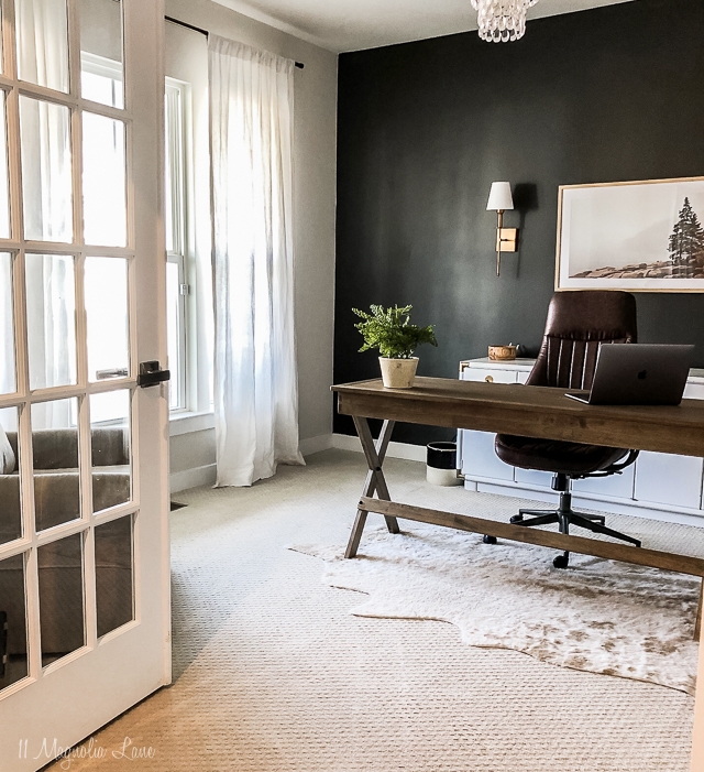 Dark Accent Wall Office Design with X-Frame Desk and Cowhide Rug