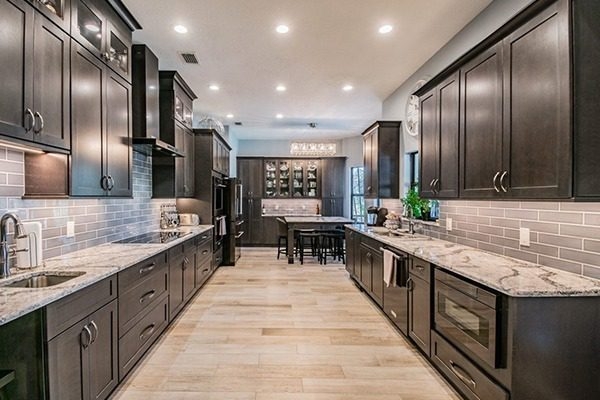 Dark Espresso Cabinets in Galley Kitchen with Built-in Microwave
