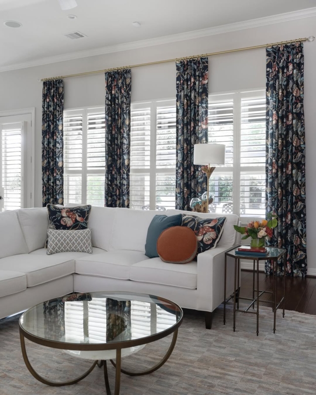 Dark Floral Drapes with Brass Rod and Plantation Shutters