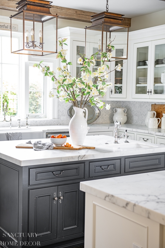 Dark Grey Kitchen Island with Herringbone Tile Backsplash