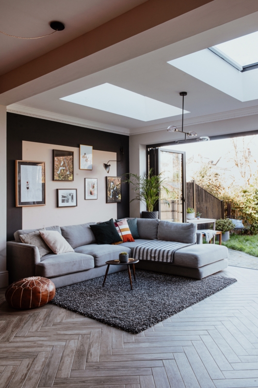 Dark Grey Textured Area Rug in a Living Room with Herringbone Floor.