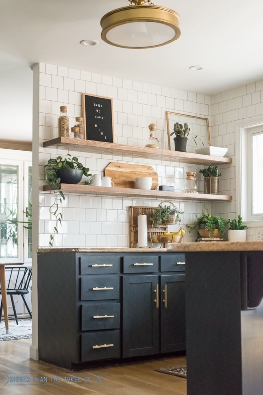 Dark Kitchen Cabinets with Gold Hardware and Wood Floating Shelves