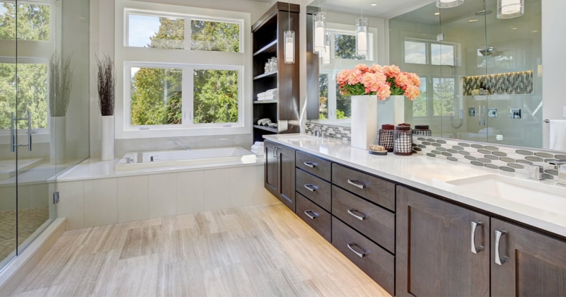 Dark Wood Double Vanity with Mosaic Tile & Large Windows