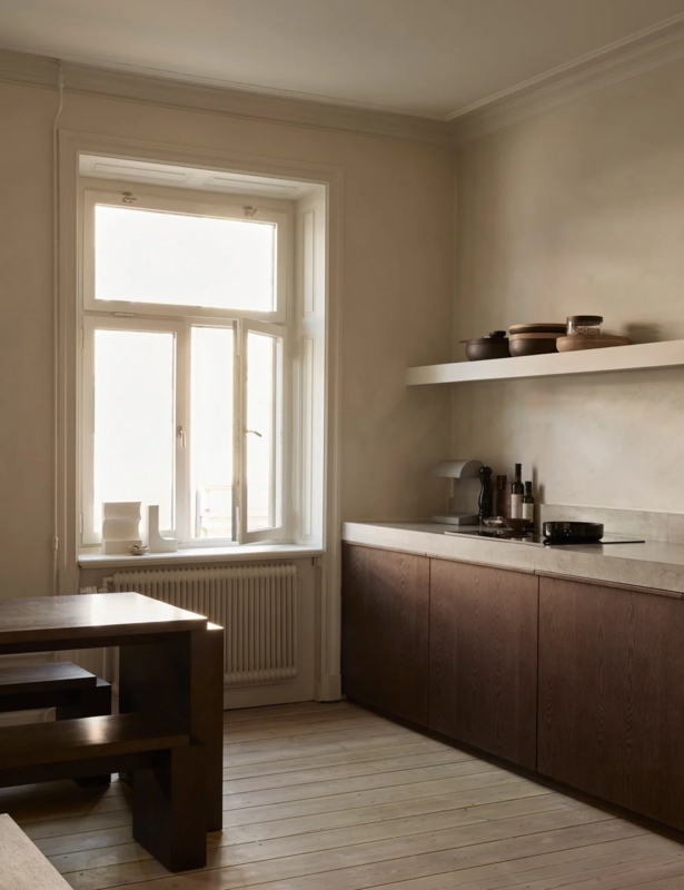 Dark Wood Flat Panel Cabinets with Stone Look Countertop and Shelf