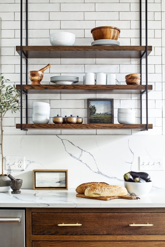 Dark Wood Open Shelving contrasting with a Marble Countertop and Tile