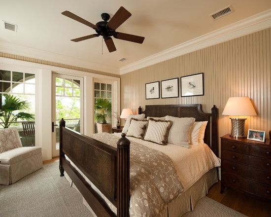 Dark Wood Poster Bed with Beadboard Accent Wall and Balcony Access