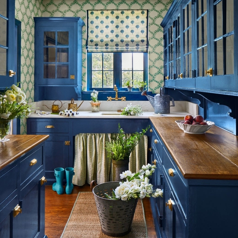 Deep Blue Kitchen Cabinets with Wood Countertops and Trellis Wallpaper