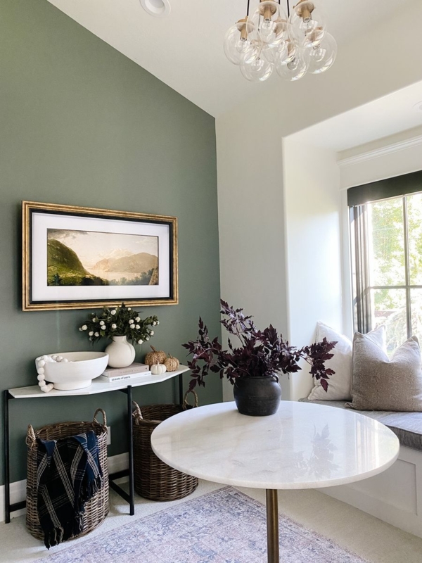 Dining Nook featuring Sage Green Accent Wall and Cozy Window Seat