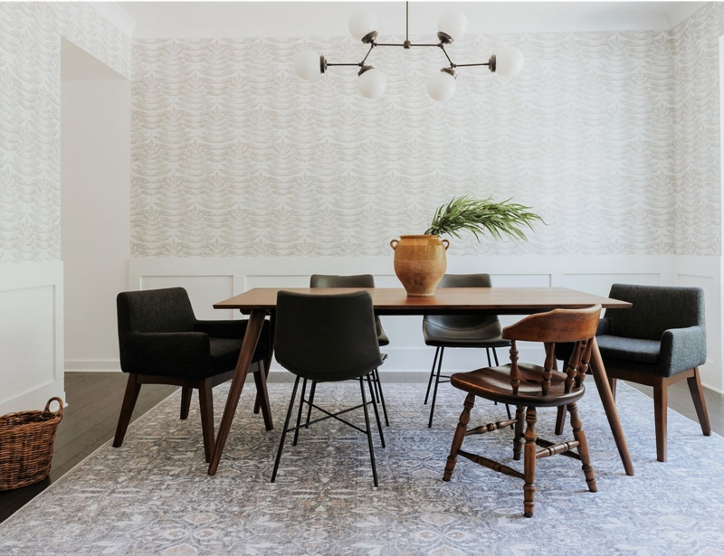 Dining Room featuring Mixed Chair Styles and Wallpaper