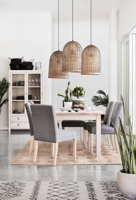 Dining Room with Jute Rug and Oversized Woven Pendants
