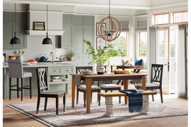 Dining Space with Sage Green Cabinets and Patterned Farmhouse Rug