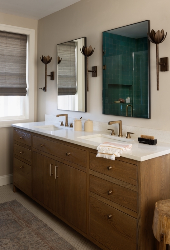 Double Vanity with Lotus Sconces & Brass Fixtures in Warm Wood Bathroom