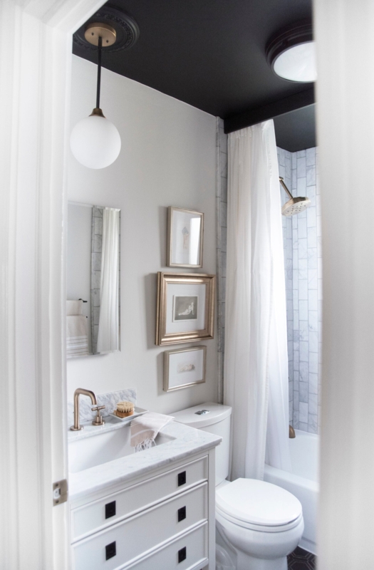 Dramatic Black Ceiling and Vertical Marble Tile