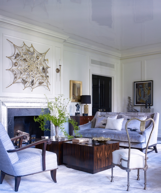 Dramatic Black Marble Fireplace: Glossy Ceiling & Web Wall Sculpture