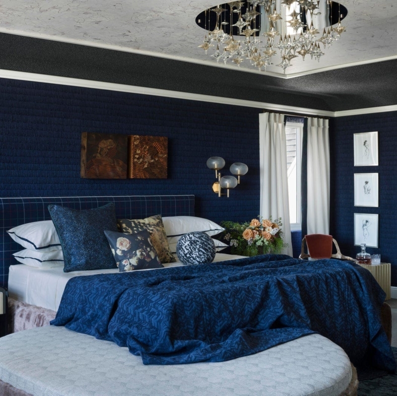 Dramatic Navy Bedroom Decor with Pleated Walls and Starburst Chandelier