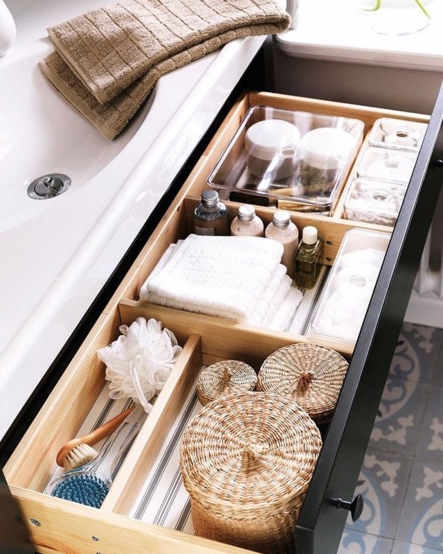 Drawer Organizer with lidded wicker storage and wood dividers. SEO: bathroom drawer storage.