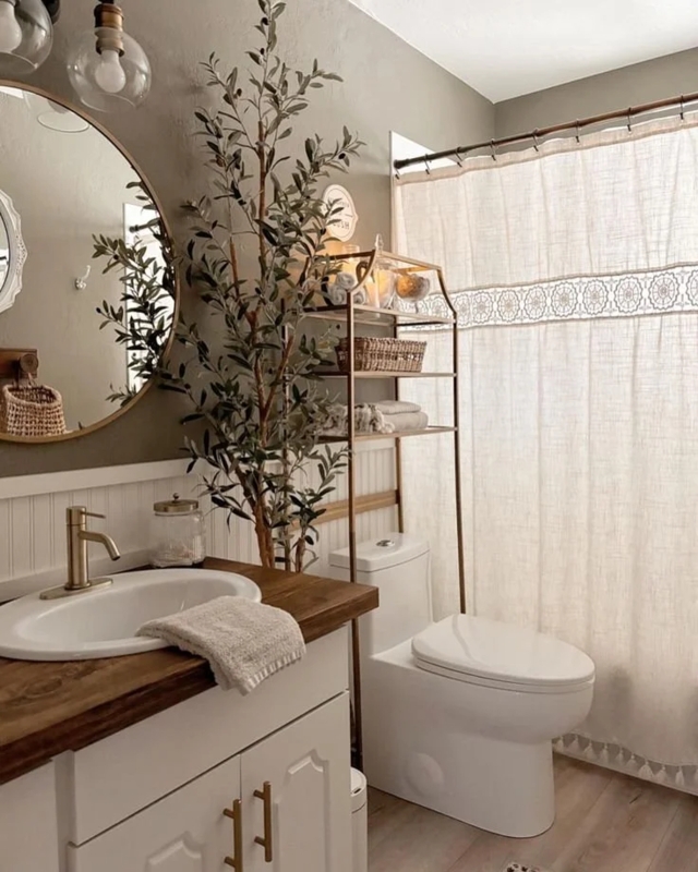 Earthy Bathroom with Wood Vanity & Gold Storage Rack