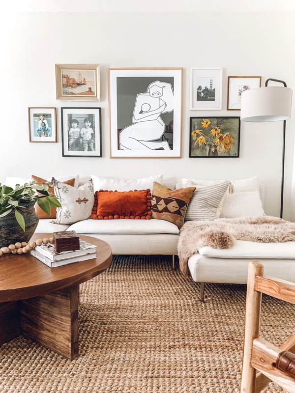 Earthy Bohemian Living Room With Curated Art And Natural Jute Rug