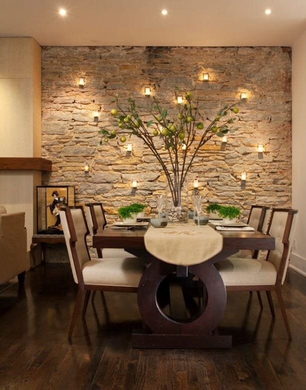 Earthy Dining Room Design with Stacked Stone Wall and Integrated Lighting
