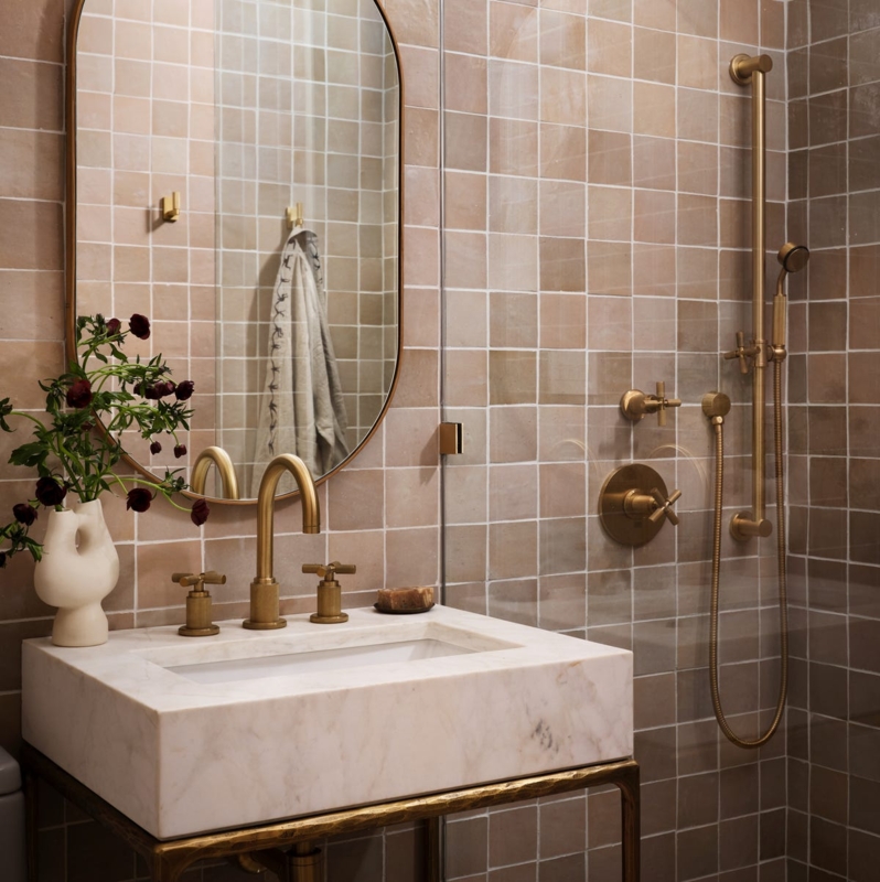 Earthy Terracotta Bathroom Tiles, Marble Block Vanity, Gold Fixtures
