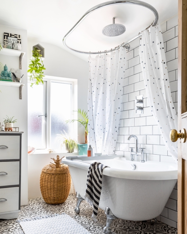 Eclectic Bathroom with Clawfoot Tub and Patterned Floor Tiles