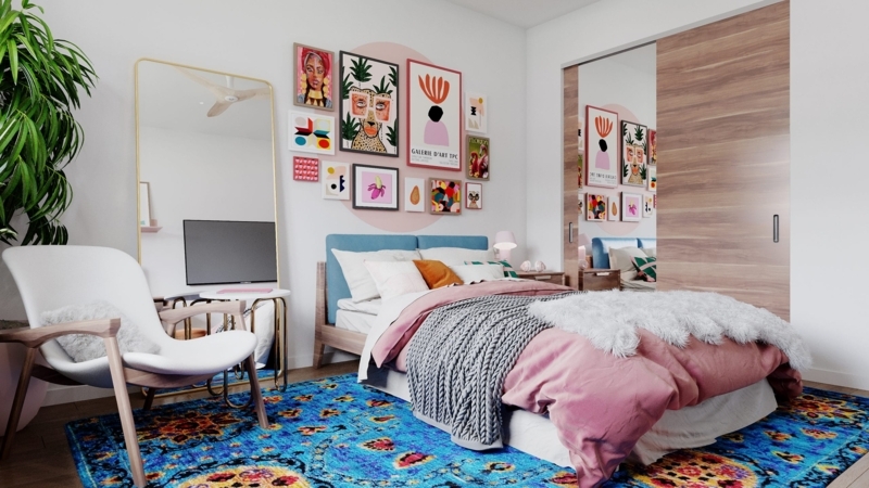 Eclectic Bedroom with a Vibrant Blue Rug and a Gallery Wall