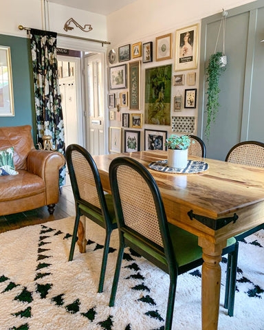 Eclectic Dining Room with Shag Rug and Dense Gallery Wall