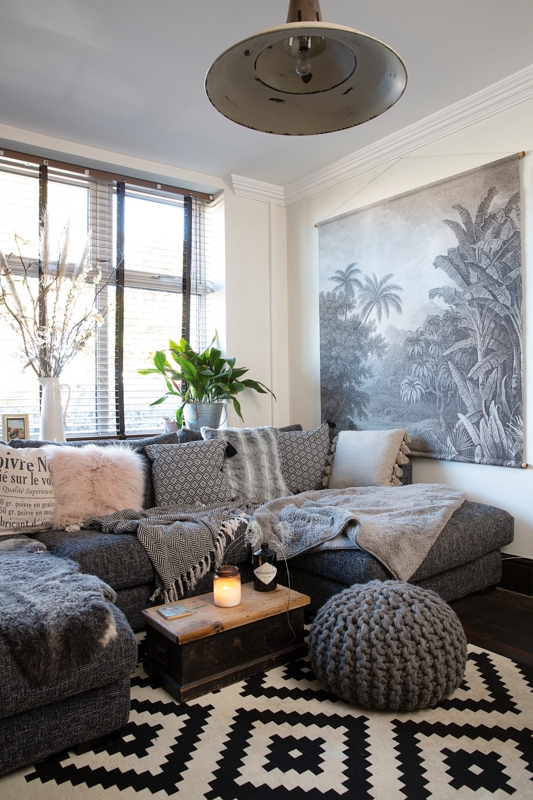 Eclectic Gray Living Room with Botanical Tapestry and Vintage Trunk