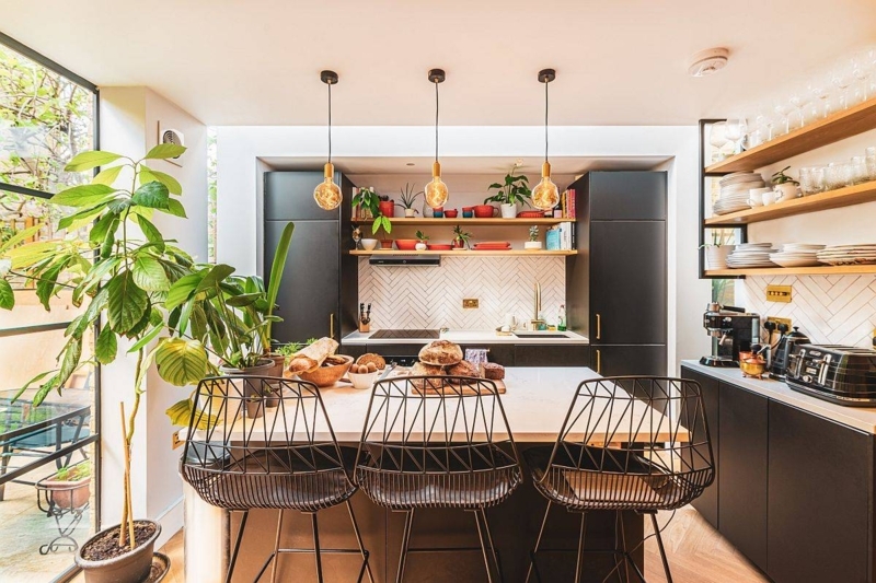 Eclectic Kitchen with Herringbone Backsplash and Wire Bar Stools