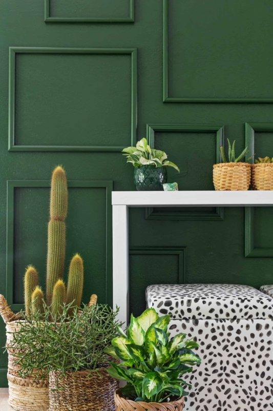 Eclectic Living Room with Dalmatian Print Ottoman and Green Molding