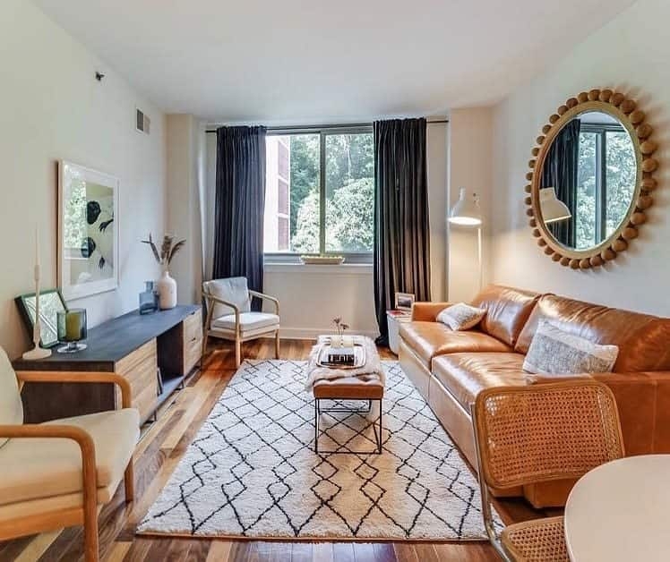 Eclectic Living Room with Geometric Rug and Beaded Round Wall Mirror