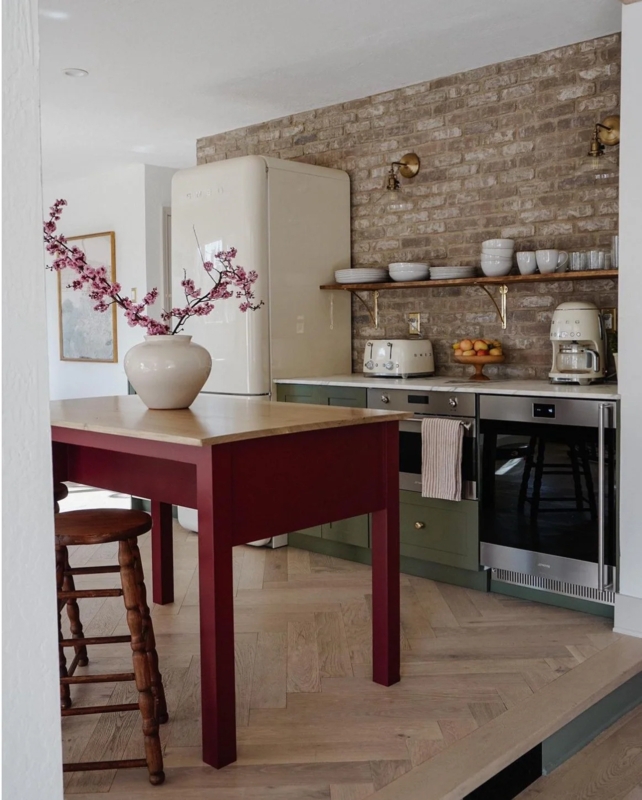 Eclectic Rustic Kitchen: Exposed Brick Wall & Herringbone Wood Floors